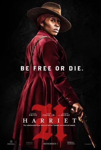 A movie poster advertising the 2019 film, "Harriet." In the blackened background stands a determined-looking dark-skinned woman in a long, striking red coat. She holds an old gun in her hand, looking over her shoulder directly at the camera. She is wearing a matching red headscarf beneath a brown ten-gallon hat. There is text centered in front of her that reads, "Be free or die." Below the text is a stylized letter H that appears to be made of blood or spray paint. In front of this is text that reads, "Harriet." Below that, there is more text that reads, "The unbelievable true story of Harriet Tubman, an American legend." 